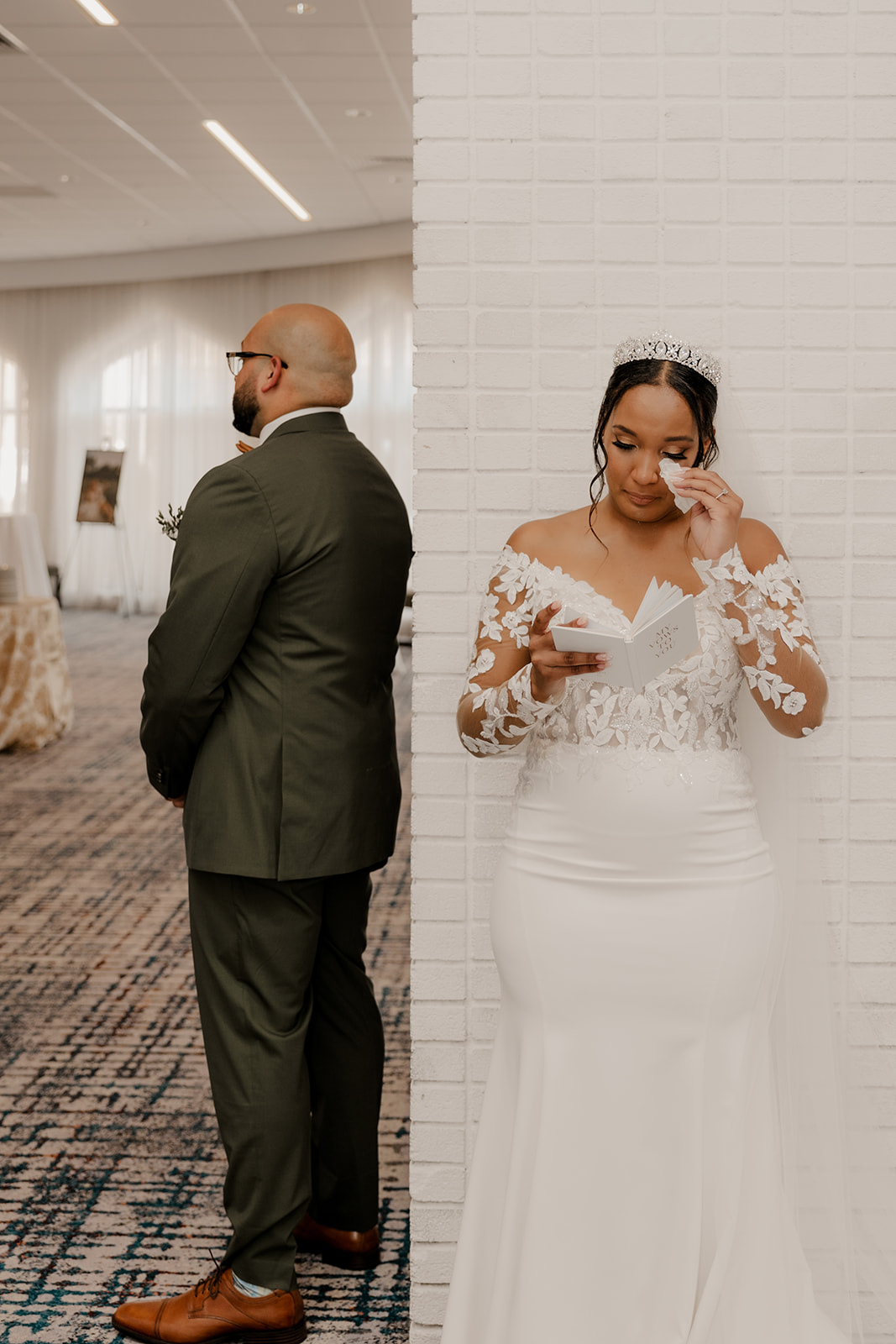 beautiful couple do a private vow and first touch ceremony around a corner 