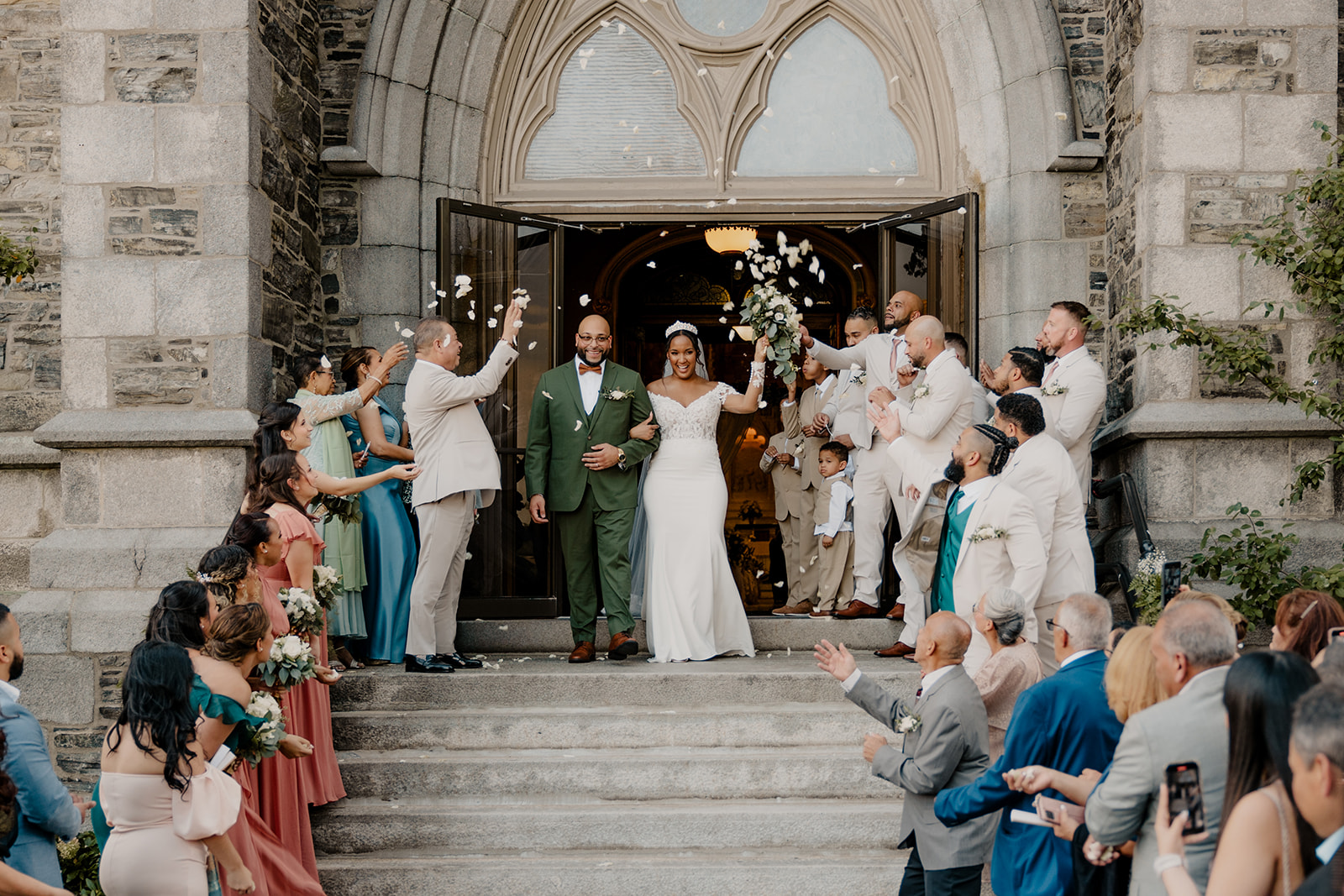 stunning couple exit a dreamy church wedding is an example of the end of the many hours of wedding photography you should plan for your wedding day!