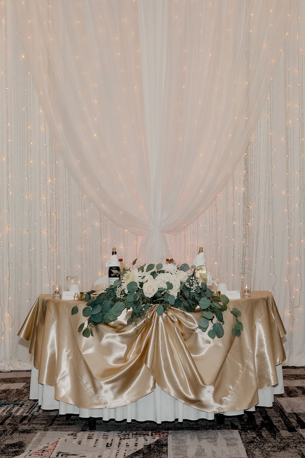 bride and grooms table sits awaiting their arrival 