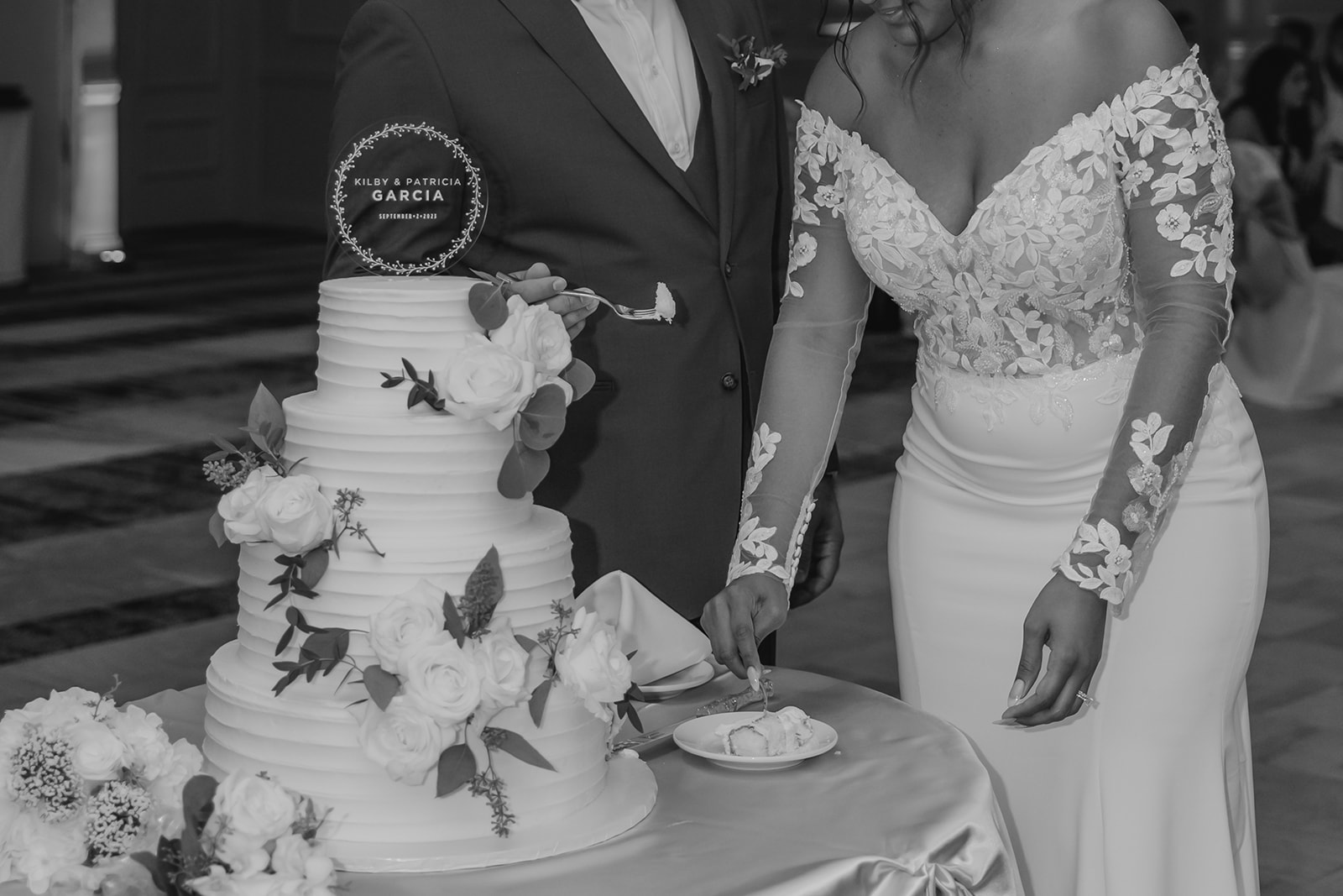 up close shot of the bride slicing her husbands cake slice