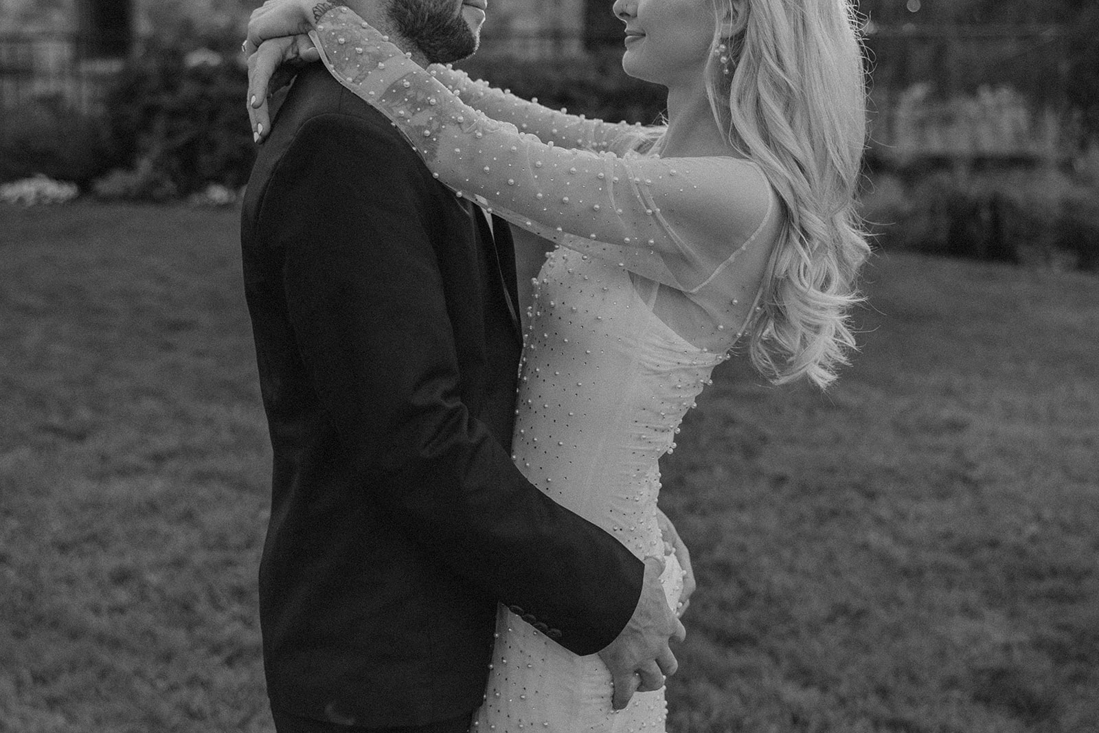 bride and groom pose together during their bride and groom portraits