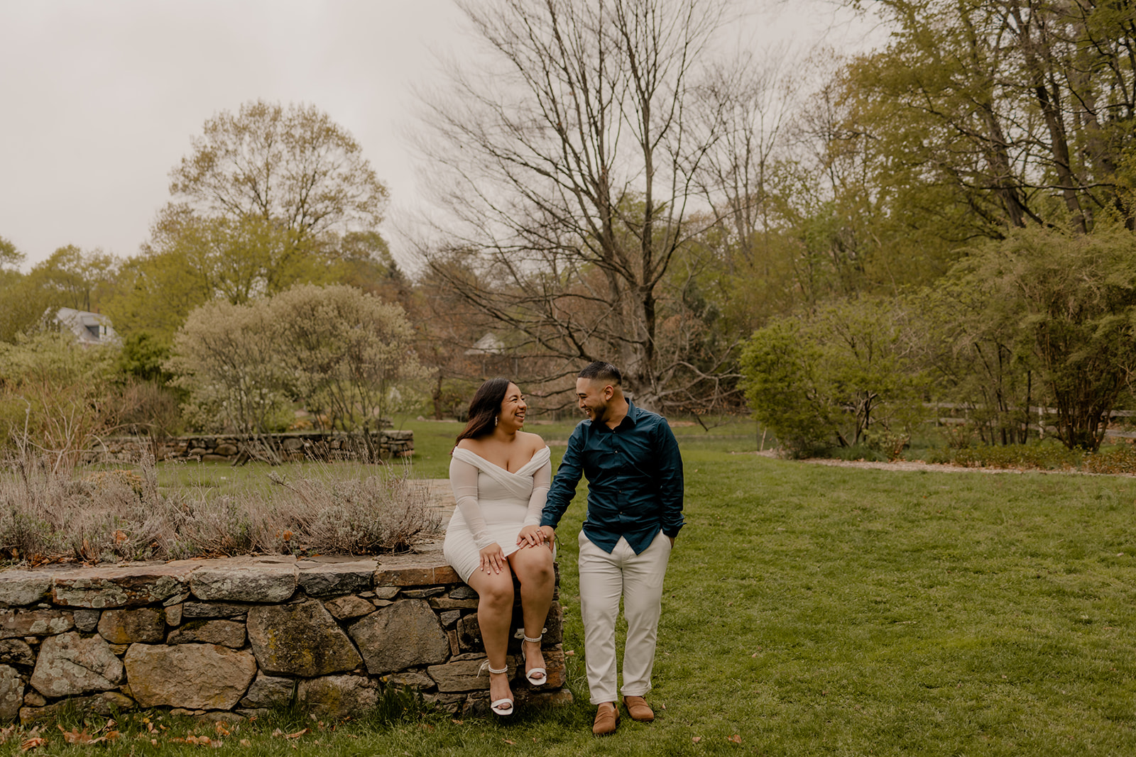 beautiful couple pose together during their Boston engagement photoshoot