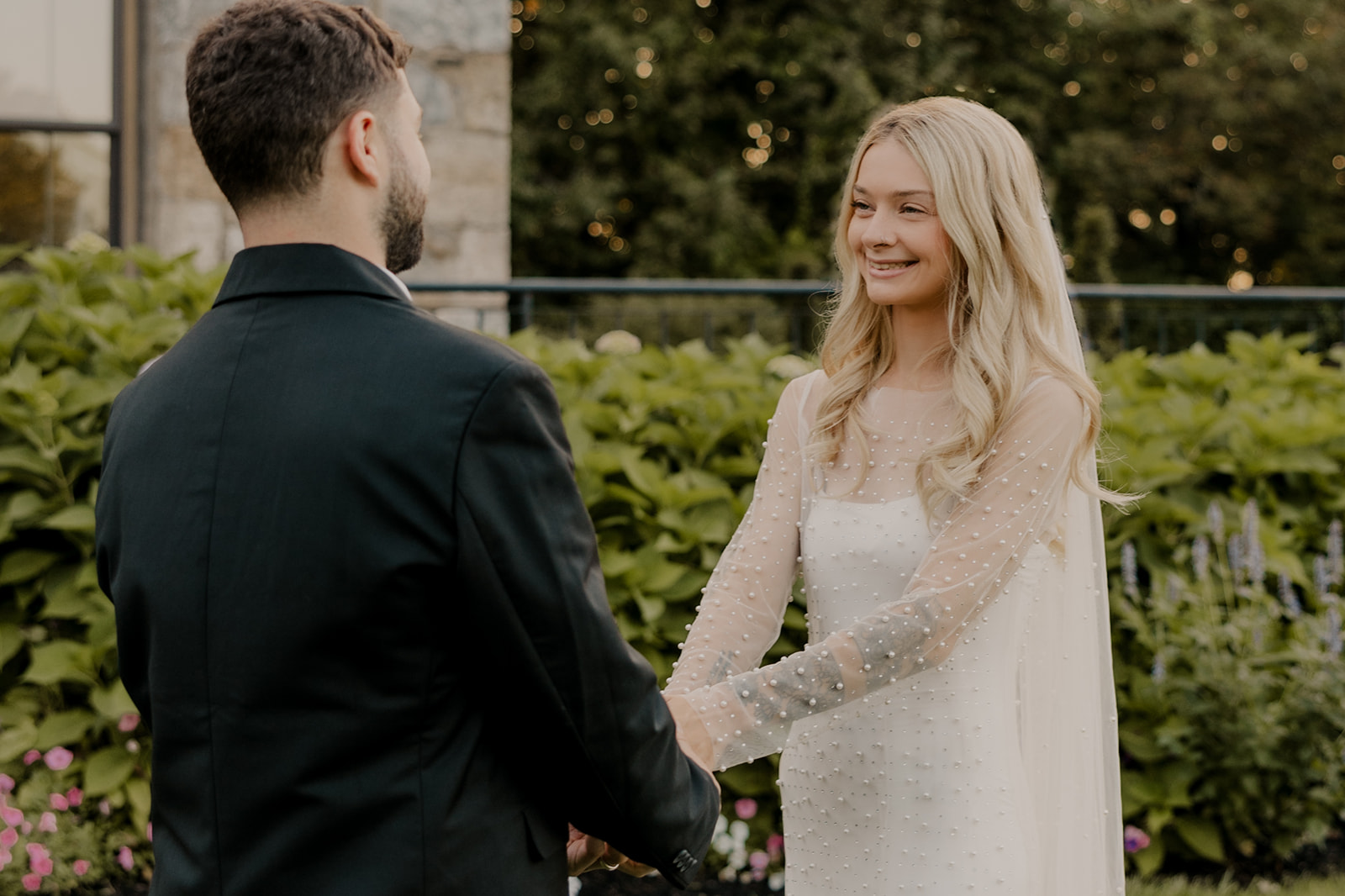 bride and groom pose together during their wedding portraits 