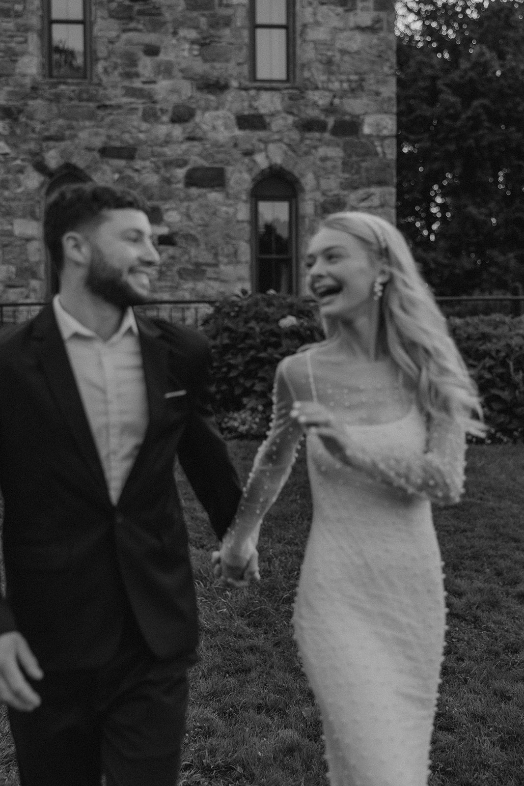 bride and groom pose together during their wedding portraits 