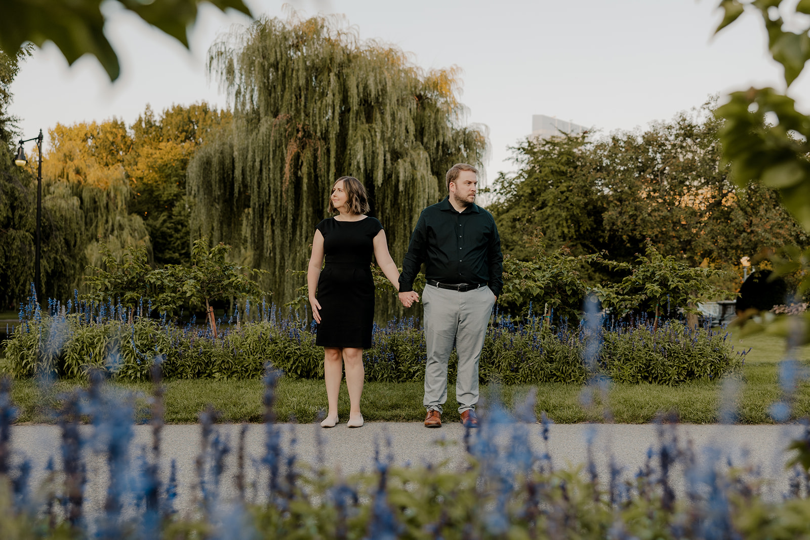 Beautiful couple pose together in a Boston garden 