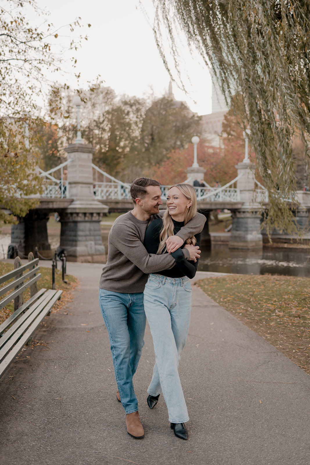 Beautiful couple walk together in the Boston Public Garden