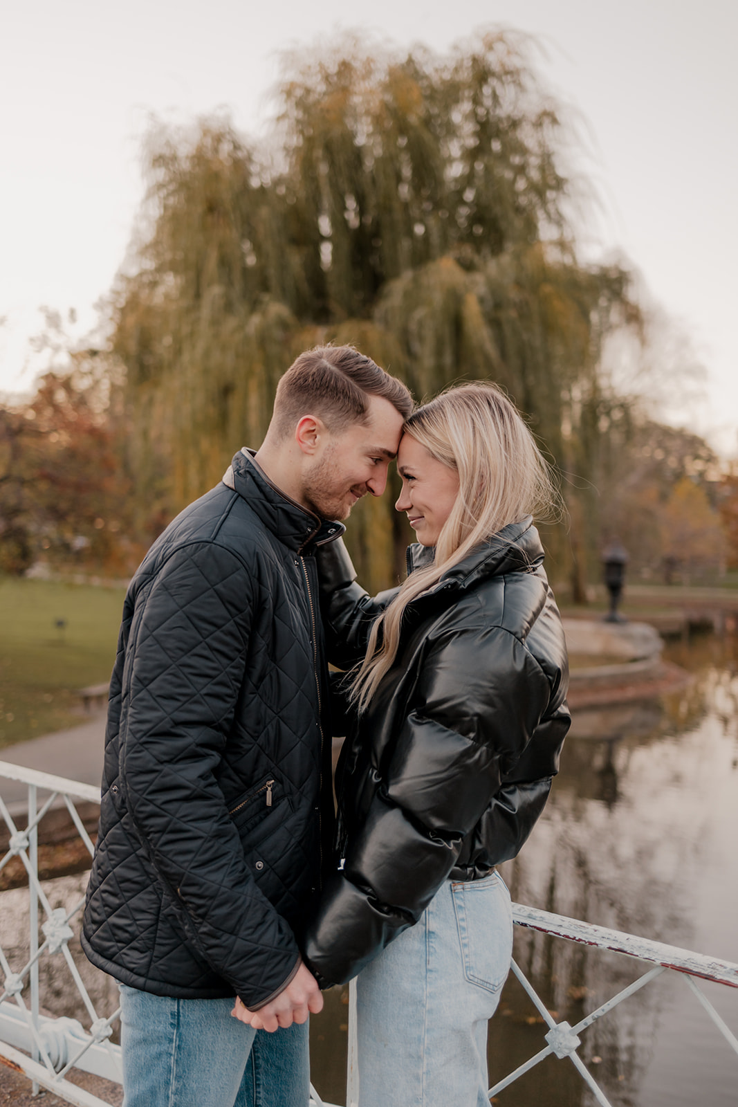 Beautiful couple pose together in a Boston garden, a perfect Boston engagement location