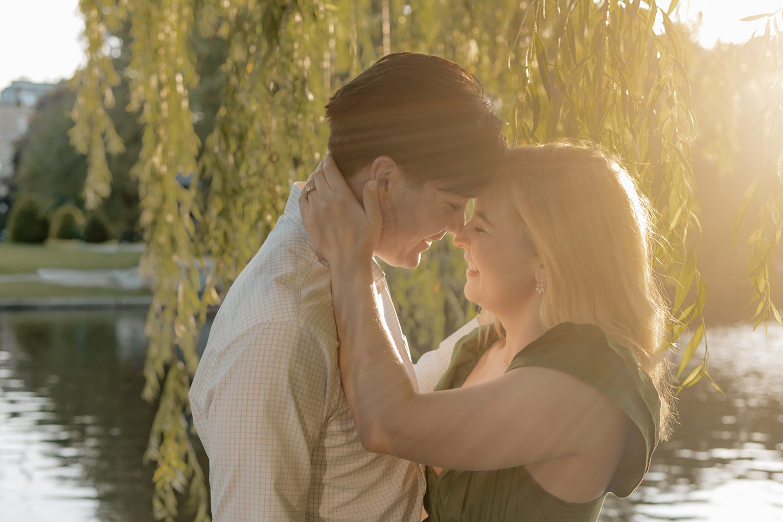 Beautiful couple pose together in a Boston garden, a perfect Boston engagement location