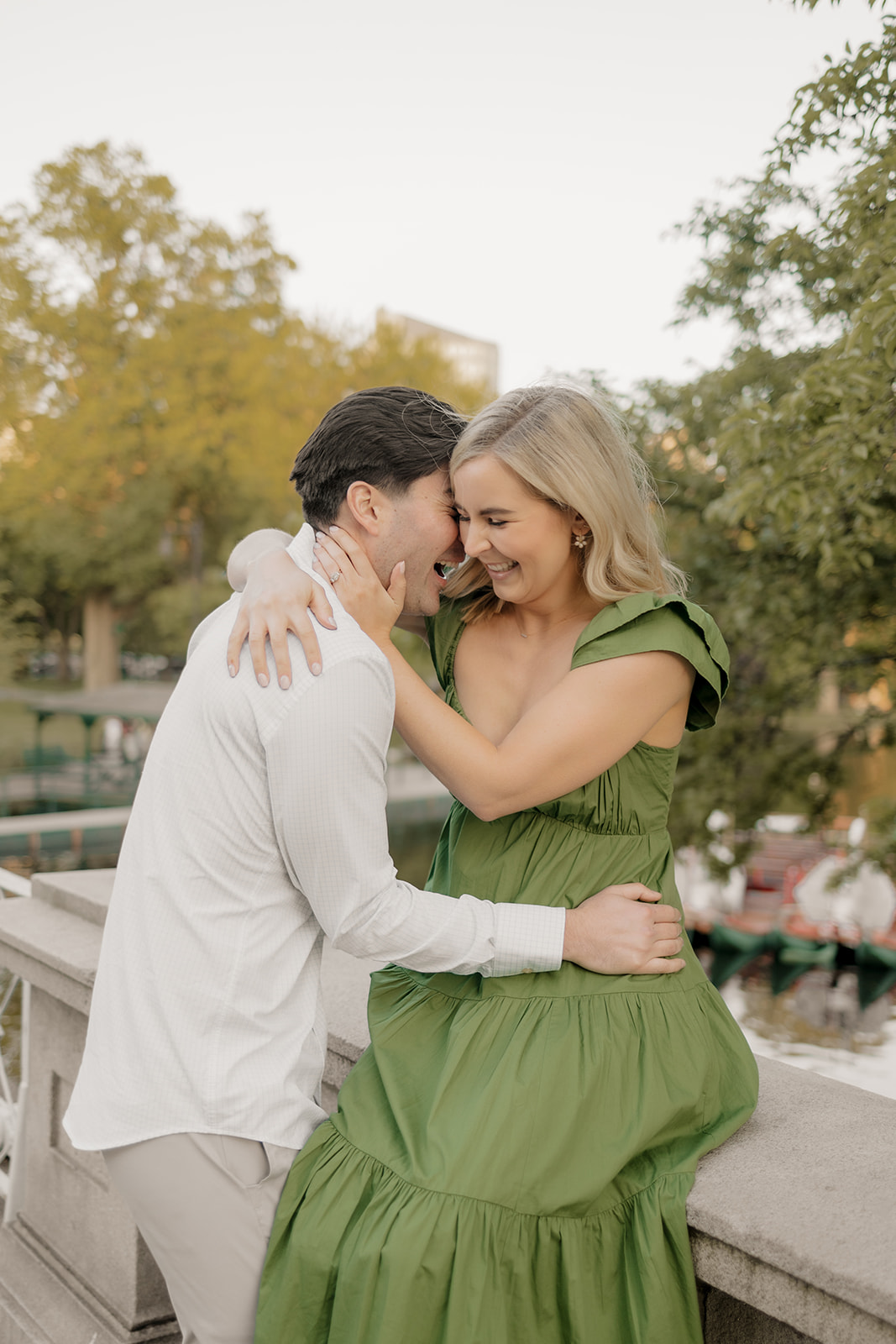 Beautiful couple pose together in a Boston garden, a perfect Boston engagement location