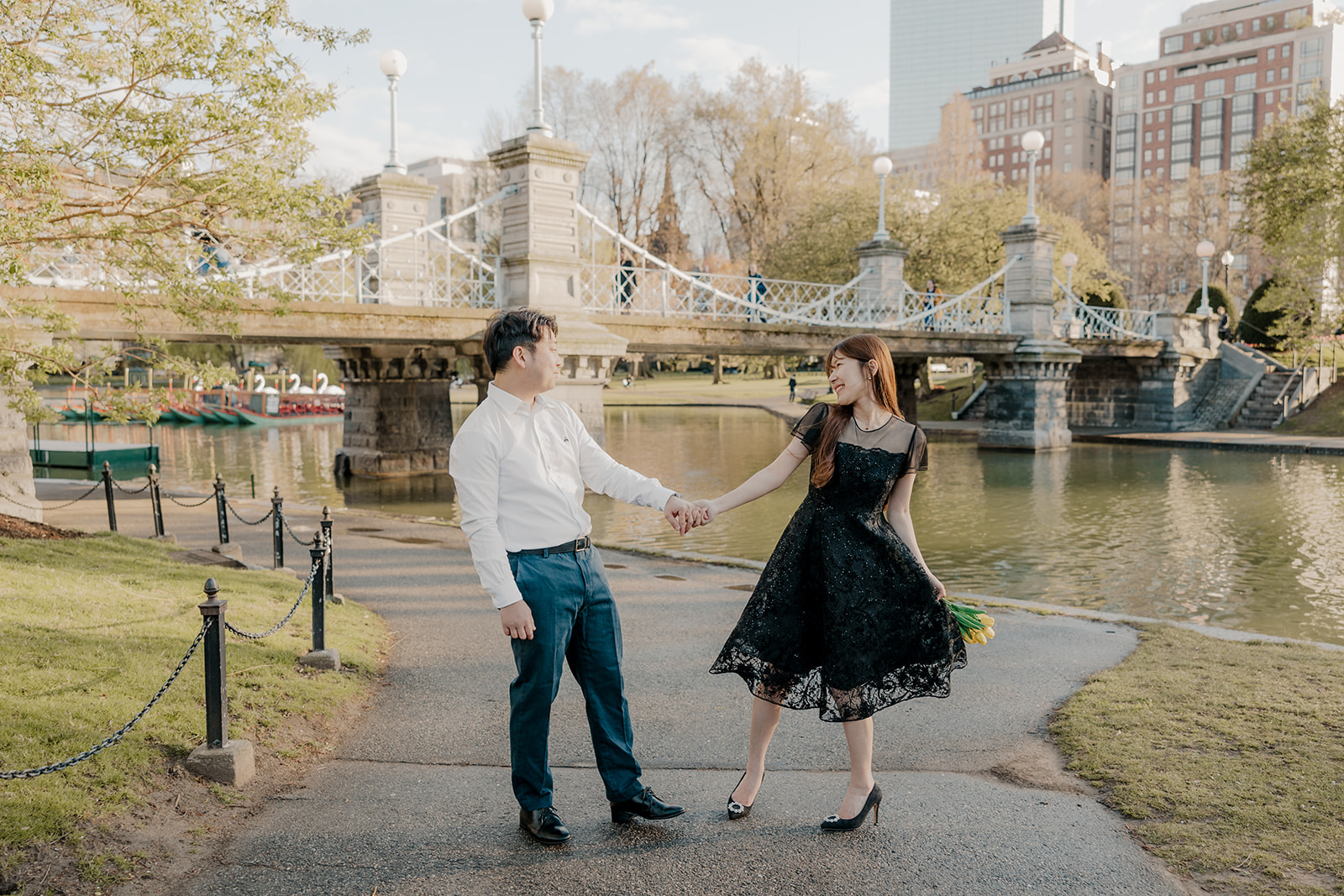 Beautiful couple pose together in a Boston garden, a perfect Boston engagement location