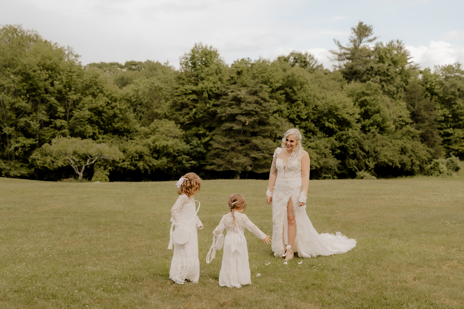 mom poses with her daughters on her elopement day