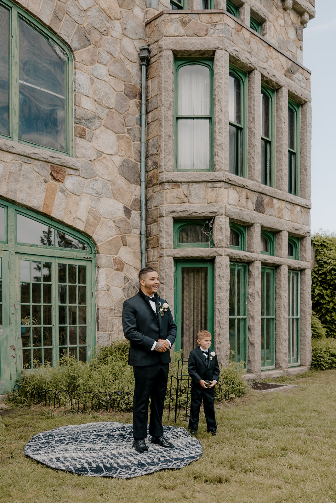 father and son wait for the ceremony to begin