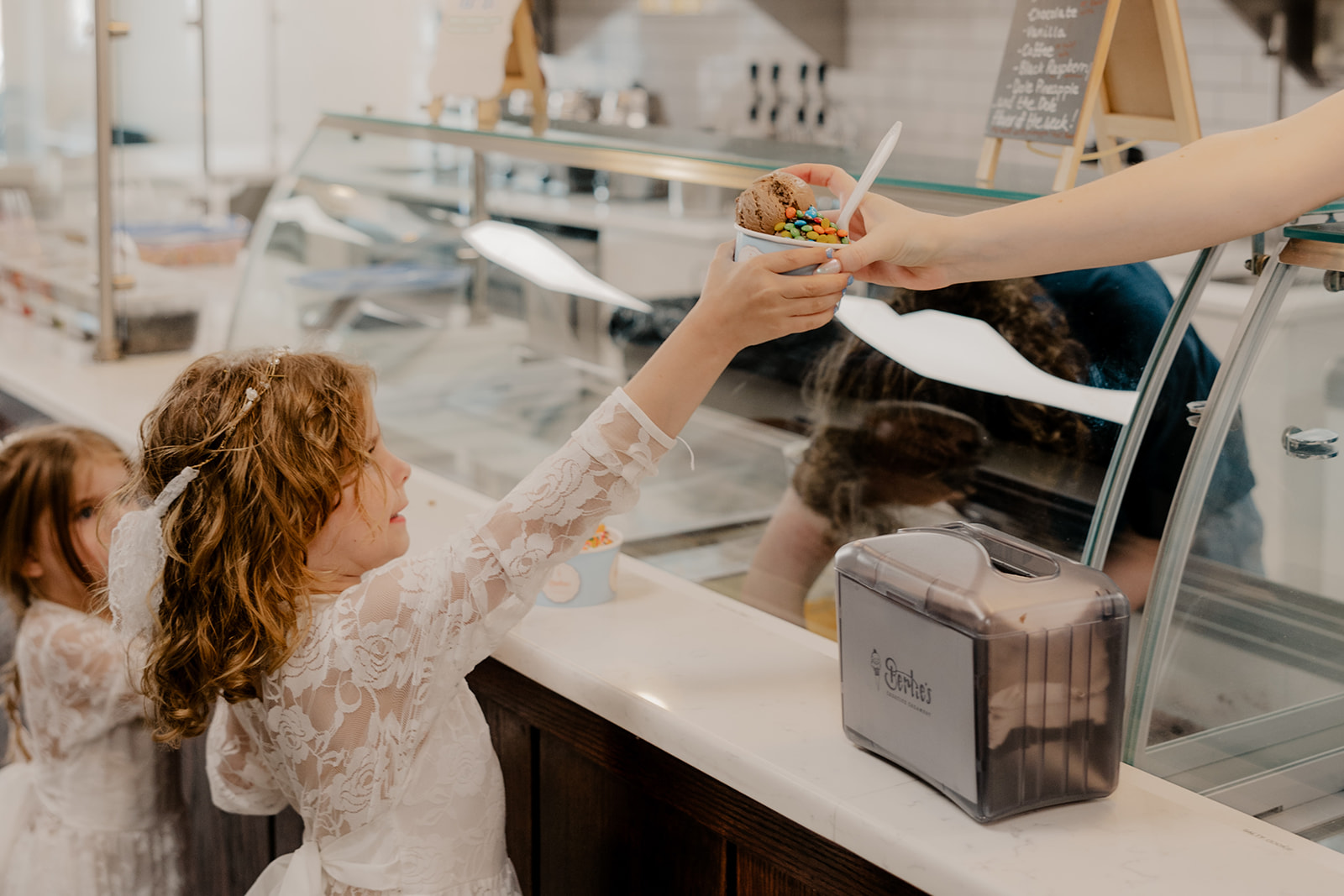 family eats ice cream together after their stunning Boston summer elopement