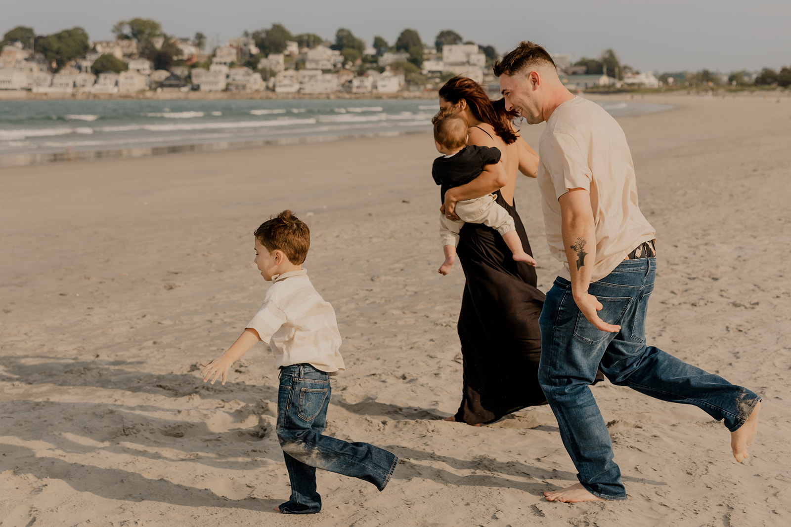 beautiful family poses together for a beach family photo session on the East Coast