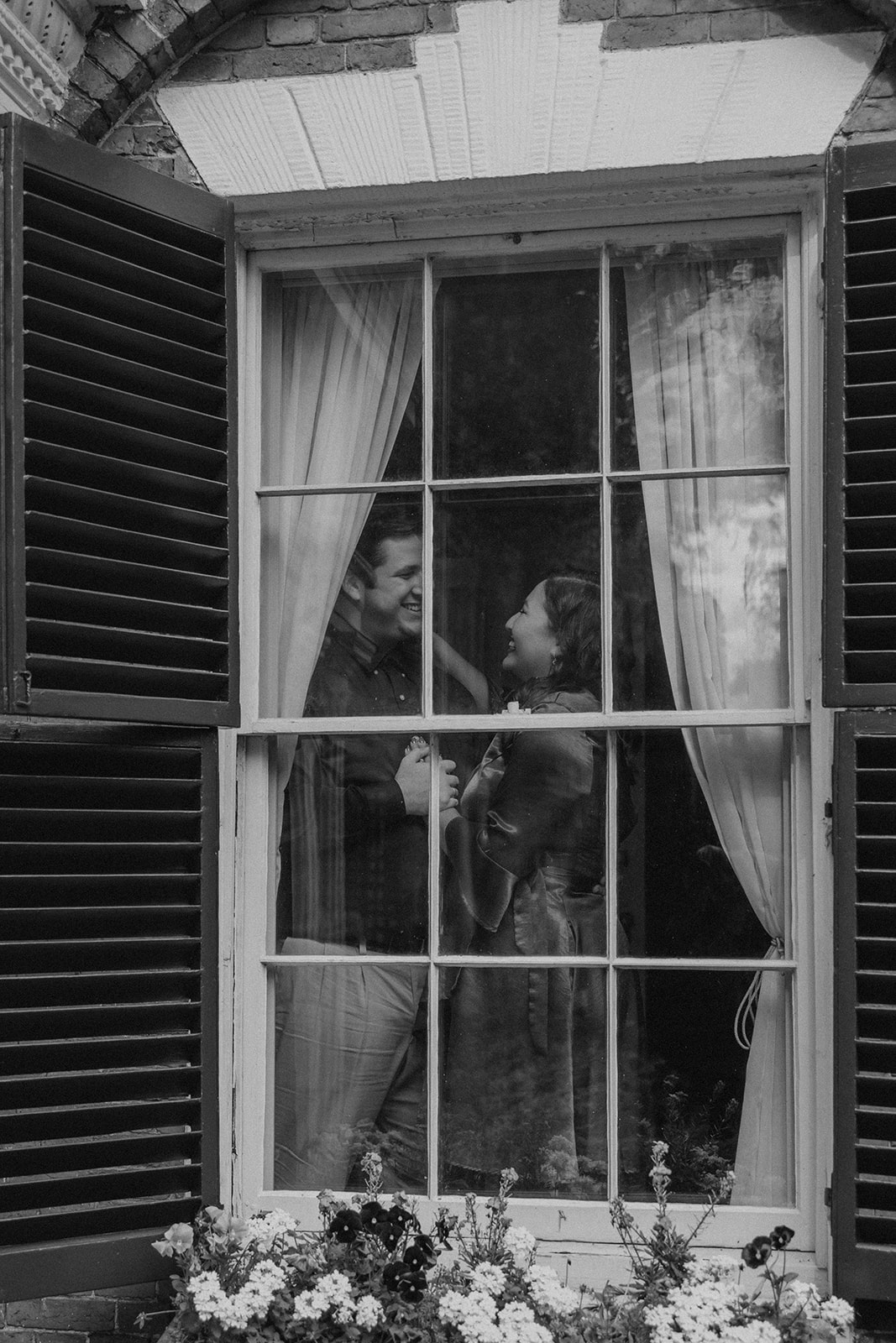 beautiful couple pose together during their Nichols House museum engagement photoshoot in Boston