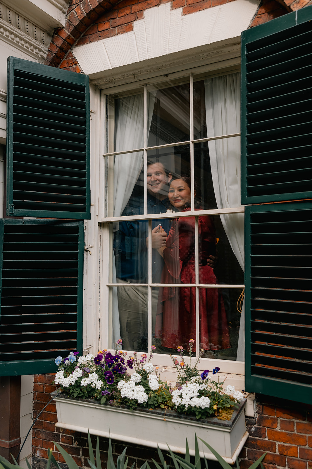 beautiful couple pose together during their Nichols House museum engagement photoshoot in Boston