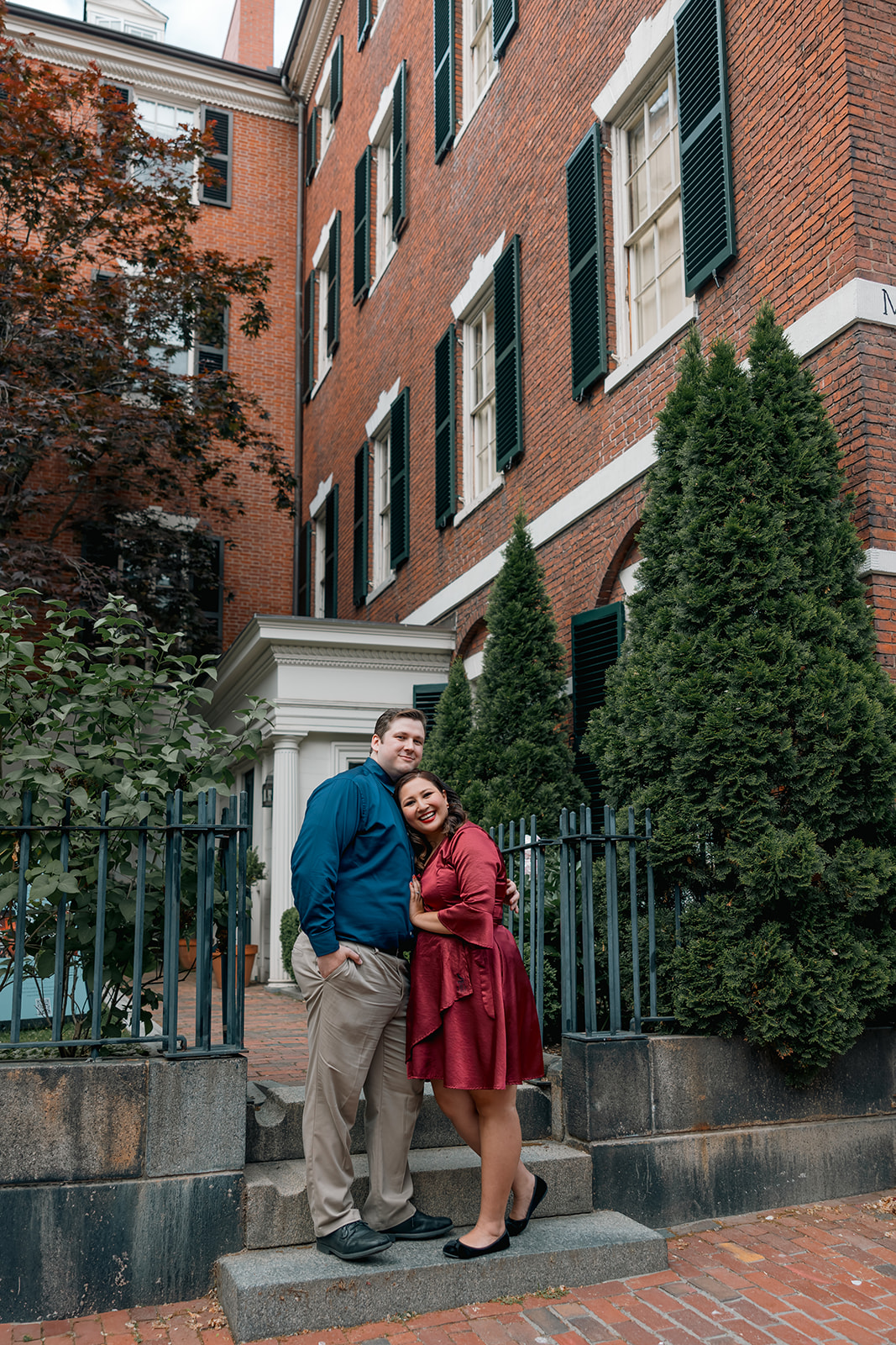 beautiful couple pose together during their Boston engagement photoshoot