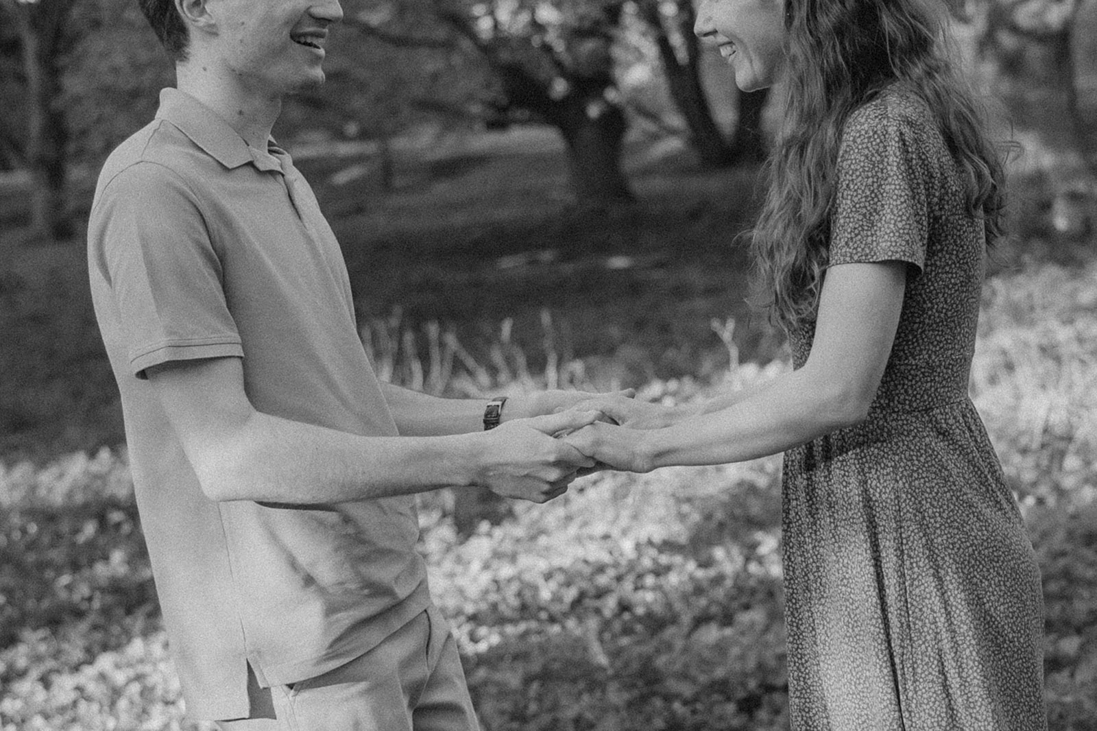 gorgeous couple take candid engagement photos during their Harvard arboretum engagement photos