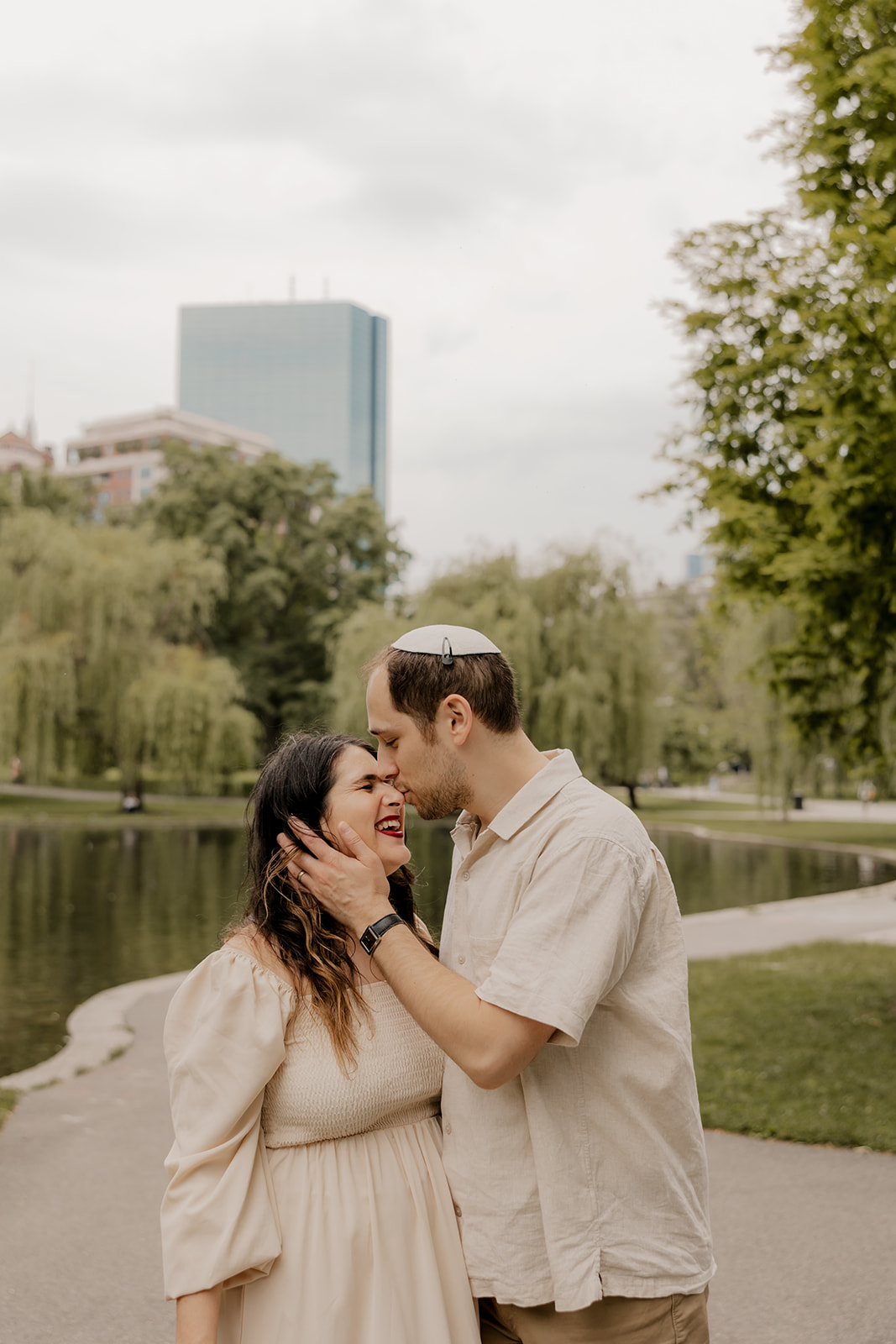 Beautiful couple pose together in a Boston garden, a perfect Boston engagement location