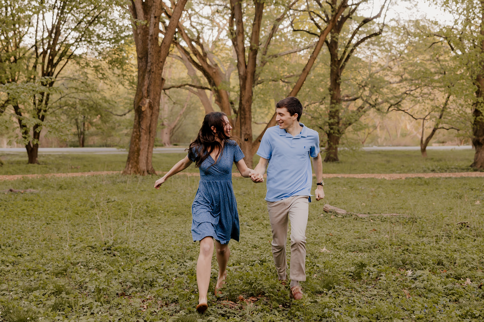 gorgeous couple take candid engagement photos during their Harvard arboretum engagement photos