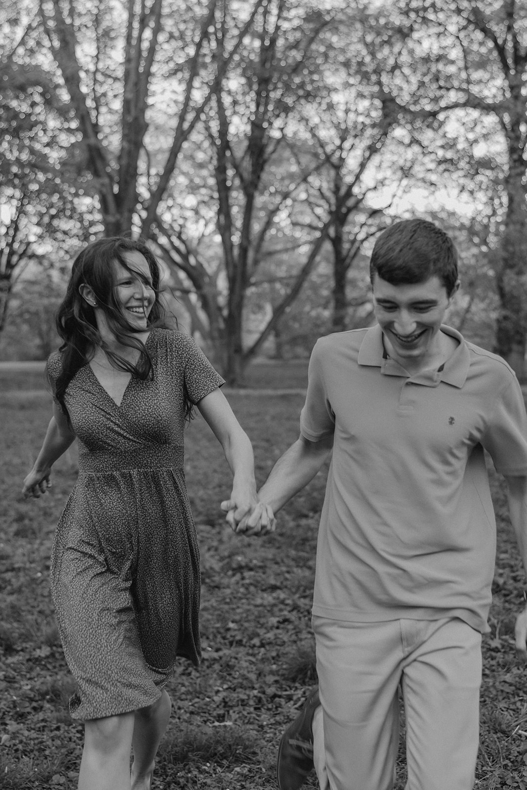 gorgeous couple take candid engagement photos during their Harvard arboretum engagement photos