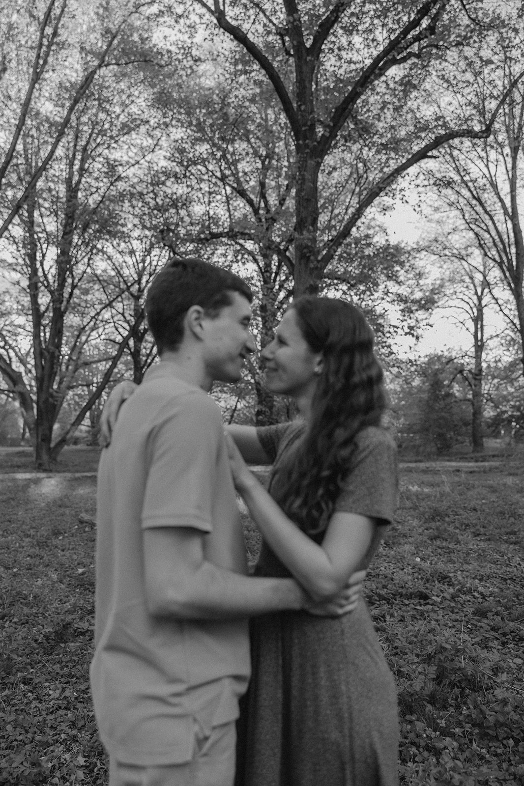 gorgeous couple take candid engagement photos during their Harvard arboretum engagement photos