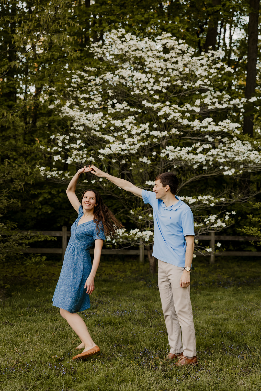 stunning couple dance together during their Harvard arboretum engagement photoshoot