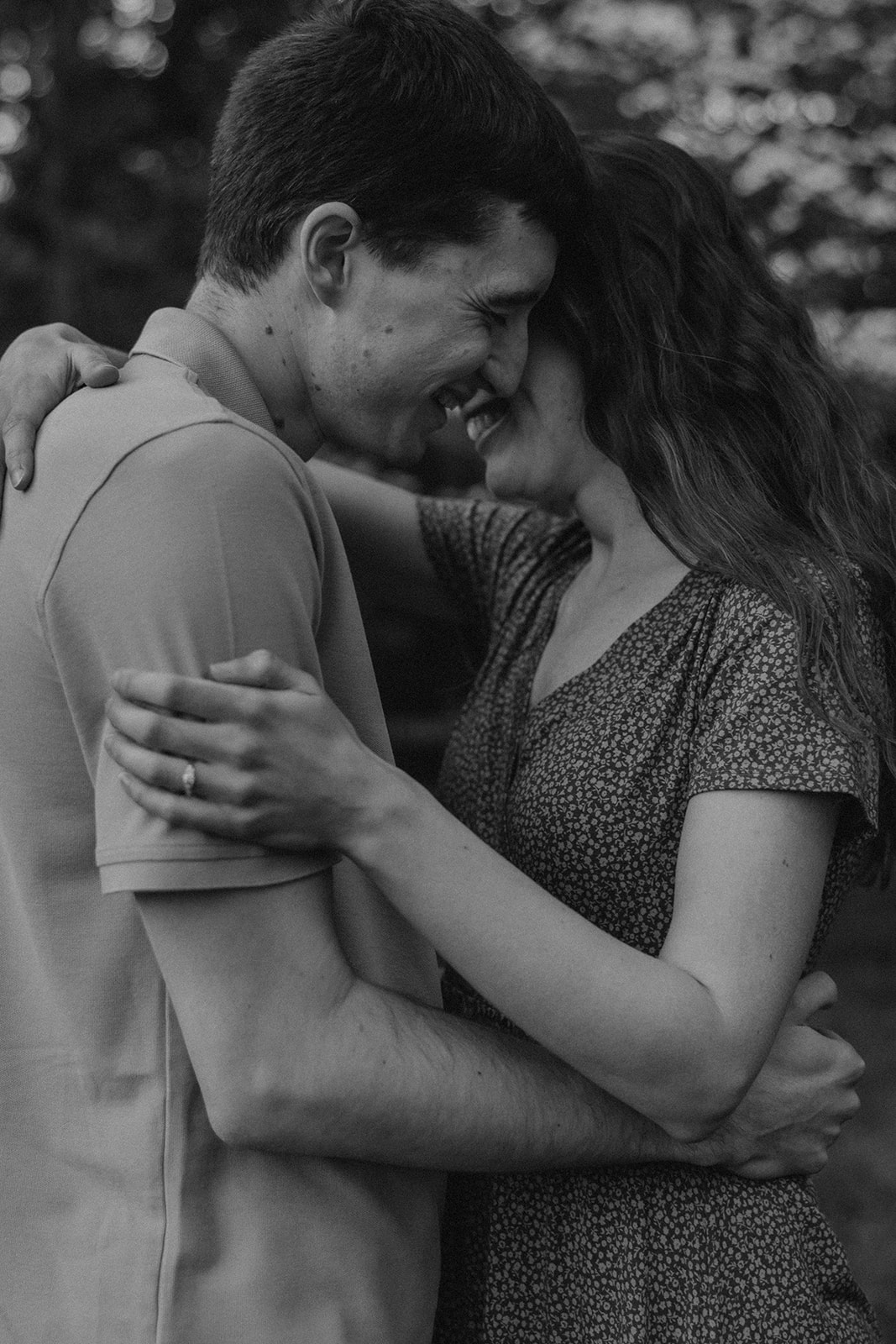 gorgeous couple take candid engagement photos during their Harvard arboretum engagement photos