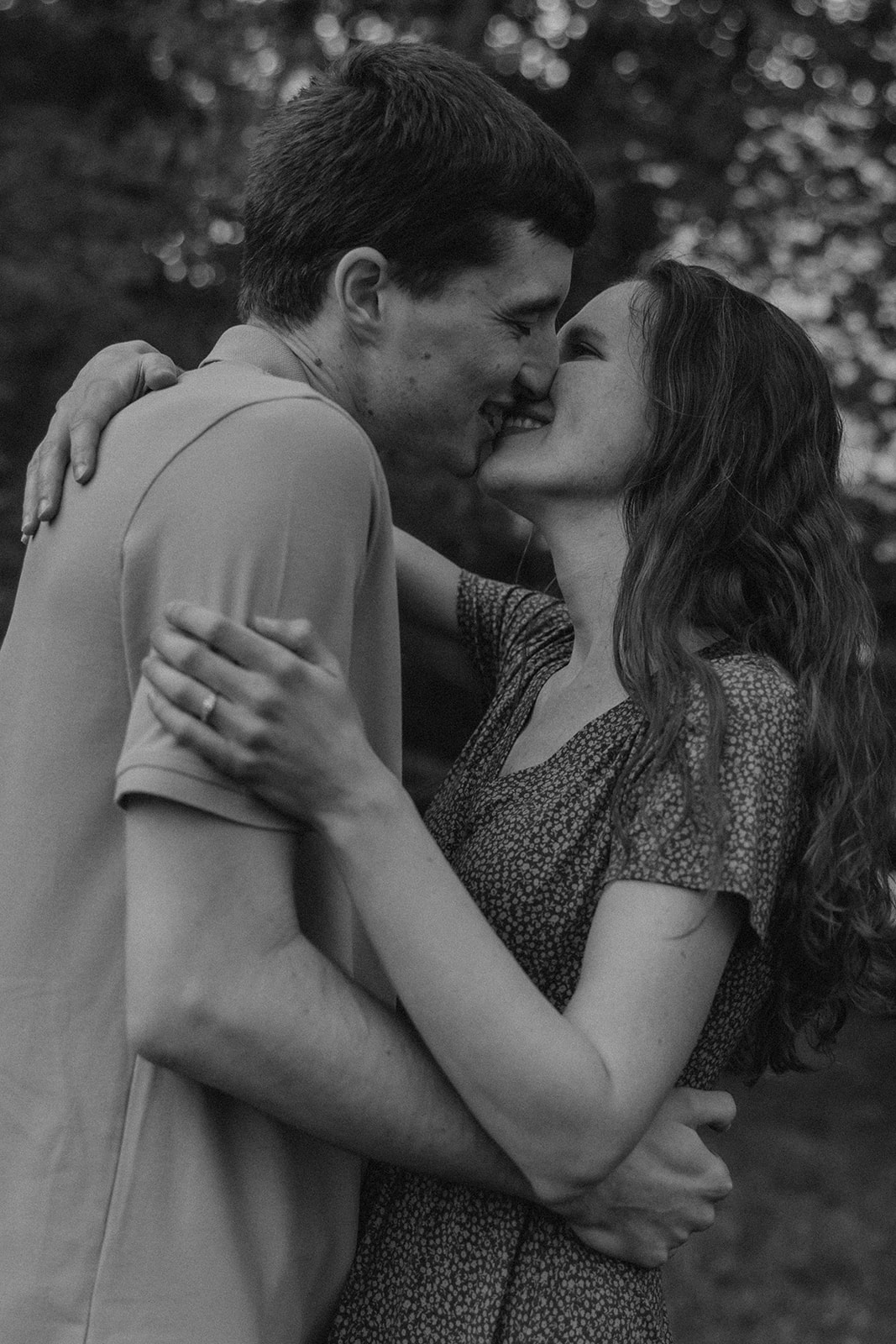 gorgeous couple take candid engagement photos during their Harvard arboretum engagement photos