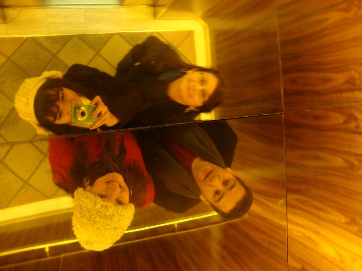 Paula and her friends pose in an elevator