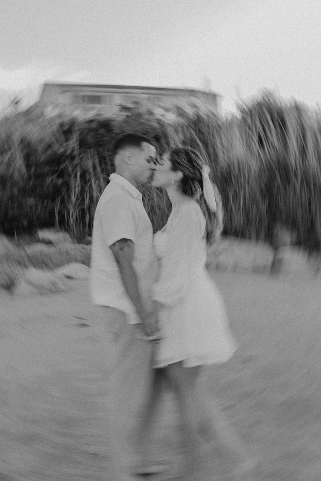 beautiful couple share a romantic pose on a beach during their New England engagement photos