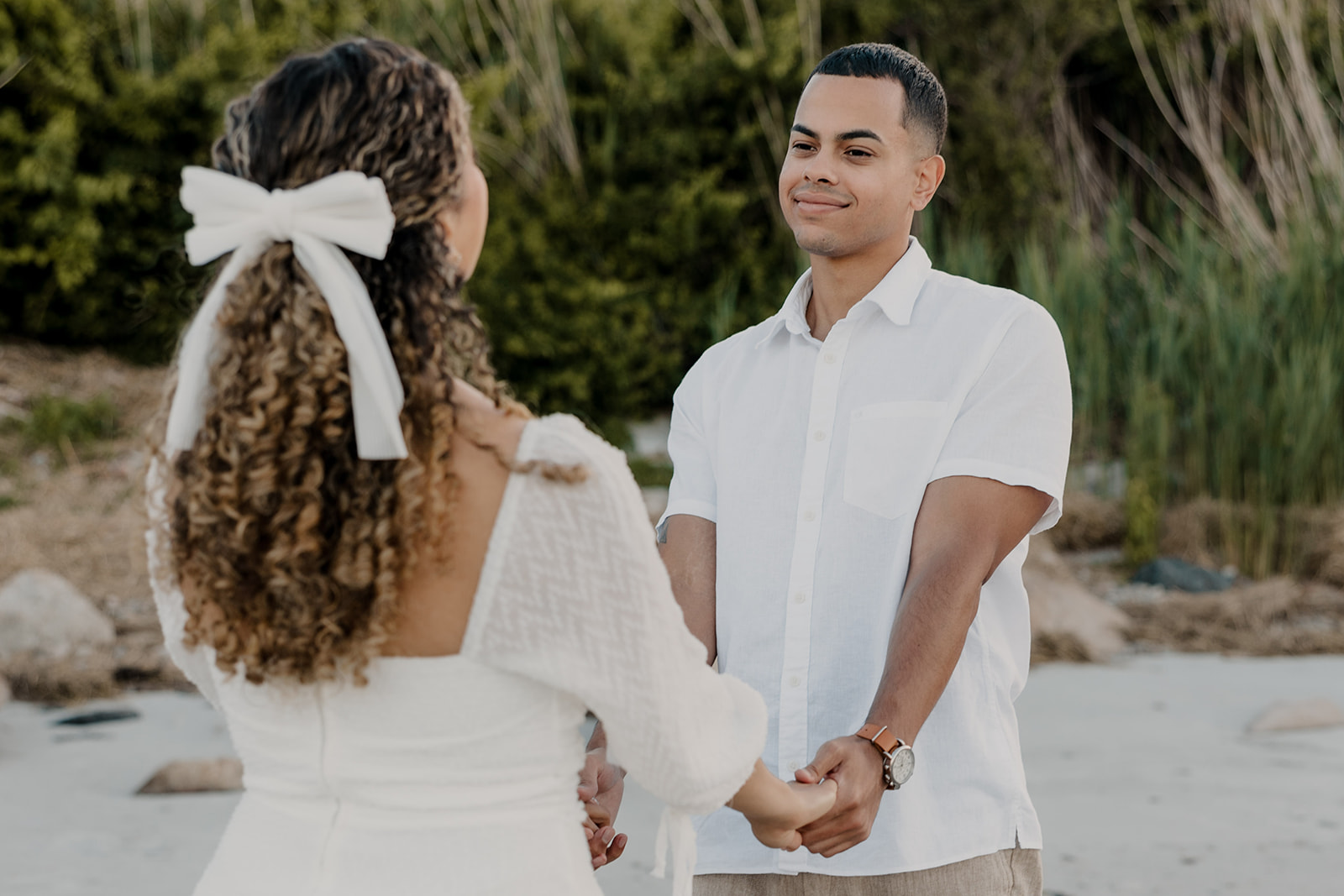 beautiful couple pose on the beach together during their New England beach engagement photoshoot