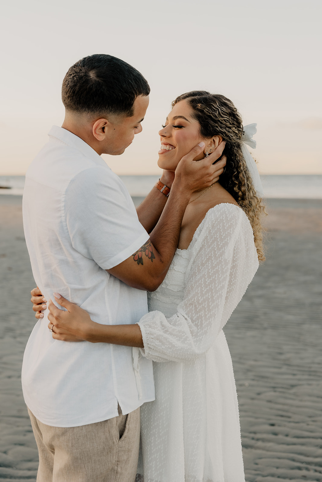 beautiful couple share a romantic pose during golden hour