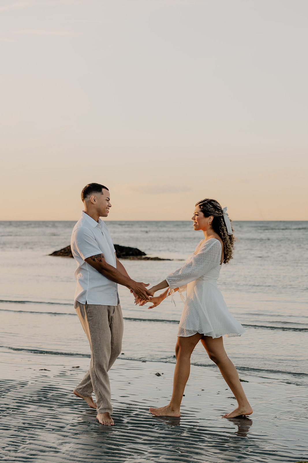 beautiful couple share a romantic pose during golden hour