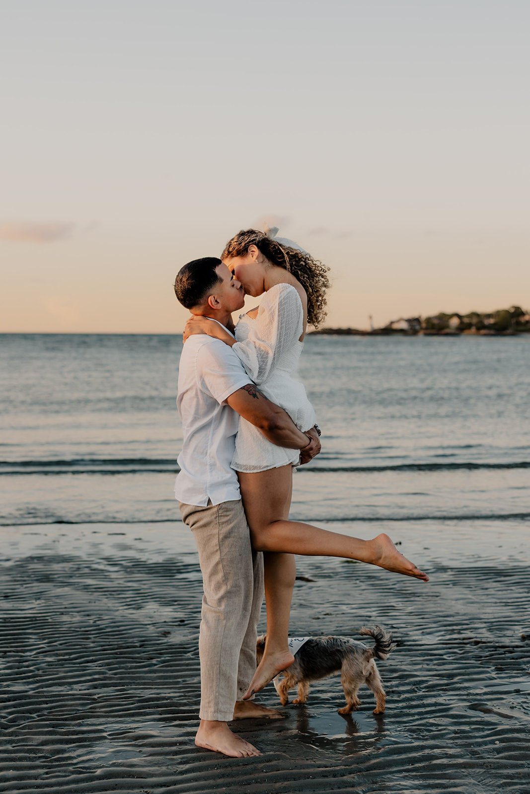 beautiful couple share a romantic pose during golden hour