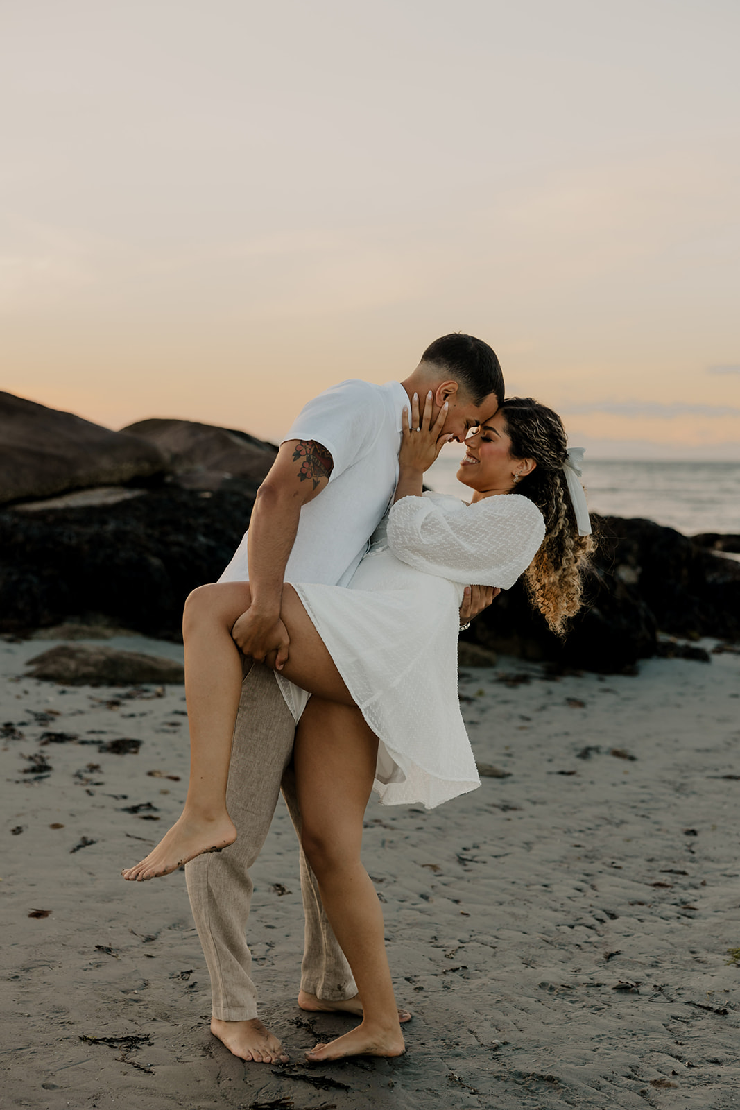 beautiful couple share a romantic pose during golden hour