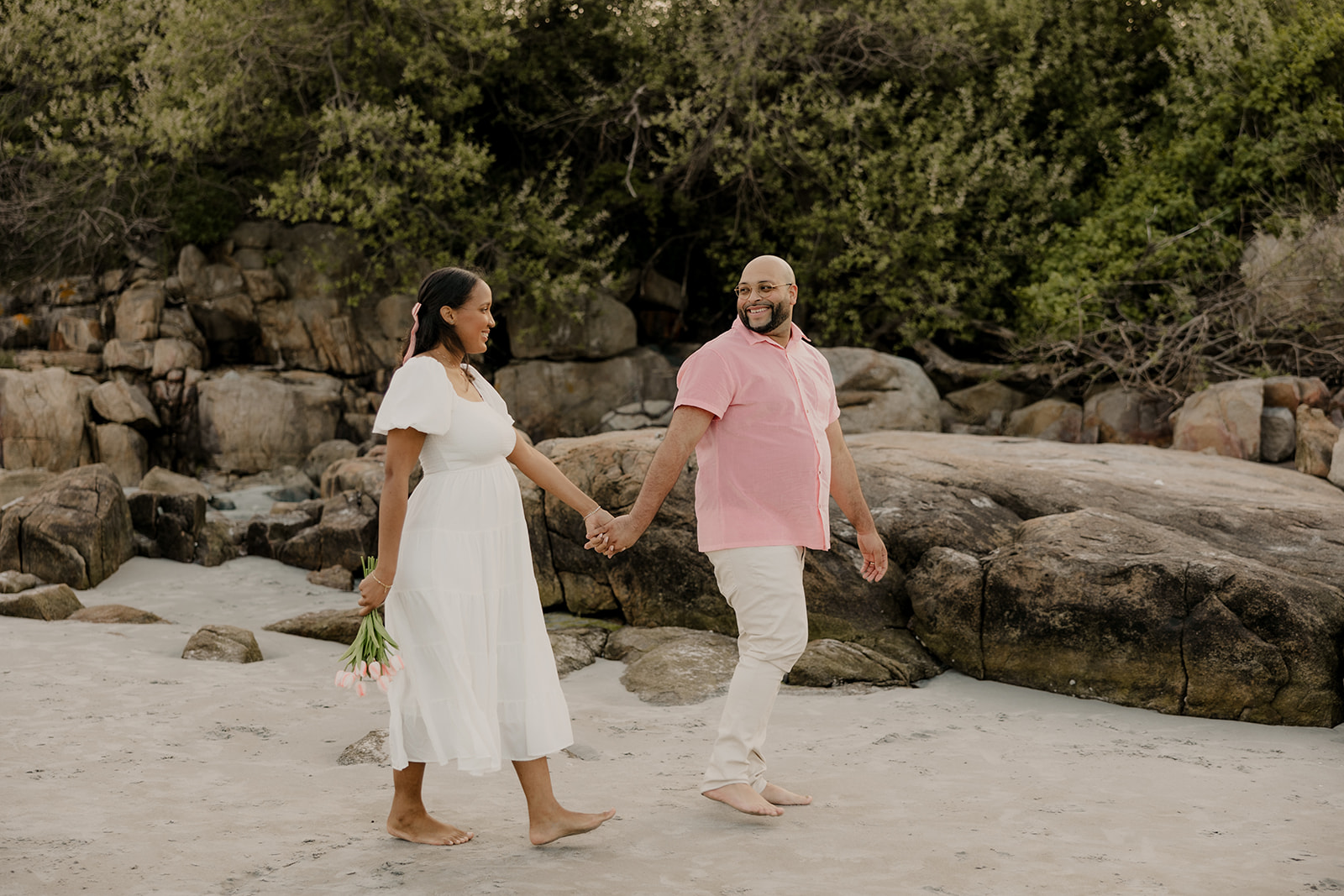 stunning couple pose together during their pregnancy announcement shoot and maternity photos