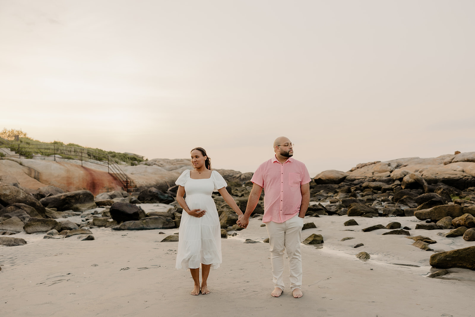 stunning couple pose together during their pregnancy announcement shoot and maternity photos