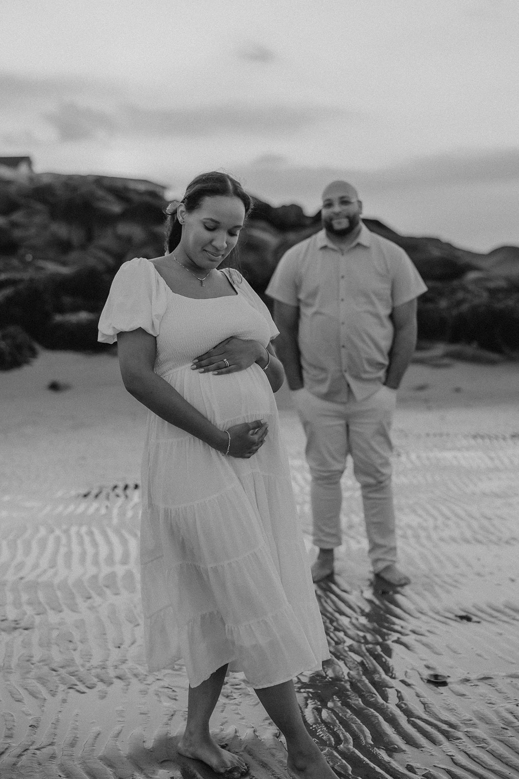 stunning couple pose together during their pregnancy announcement shoot and maternity photos