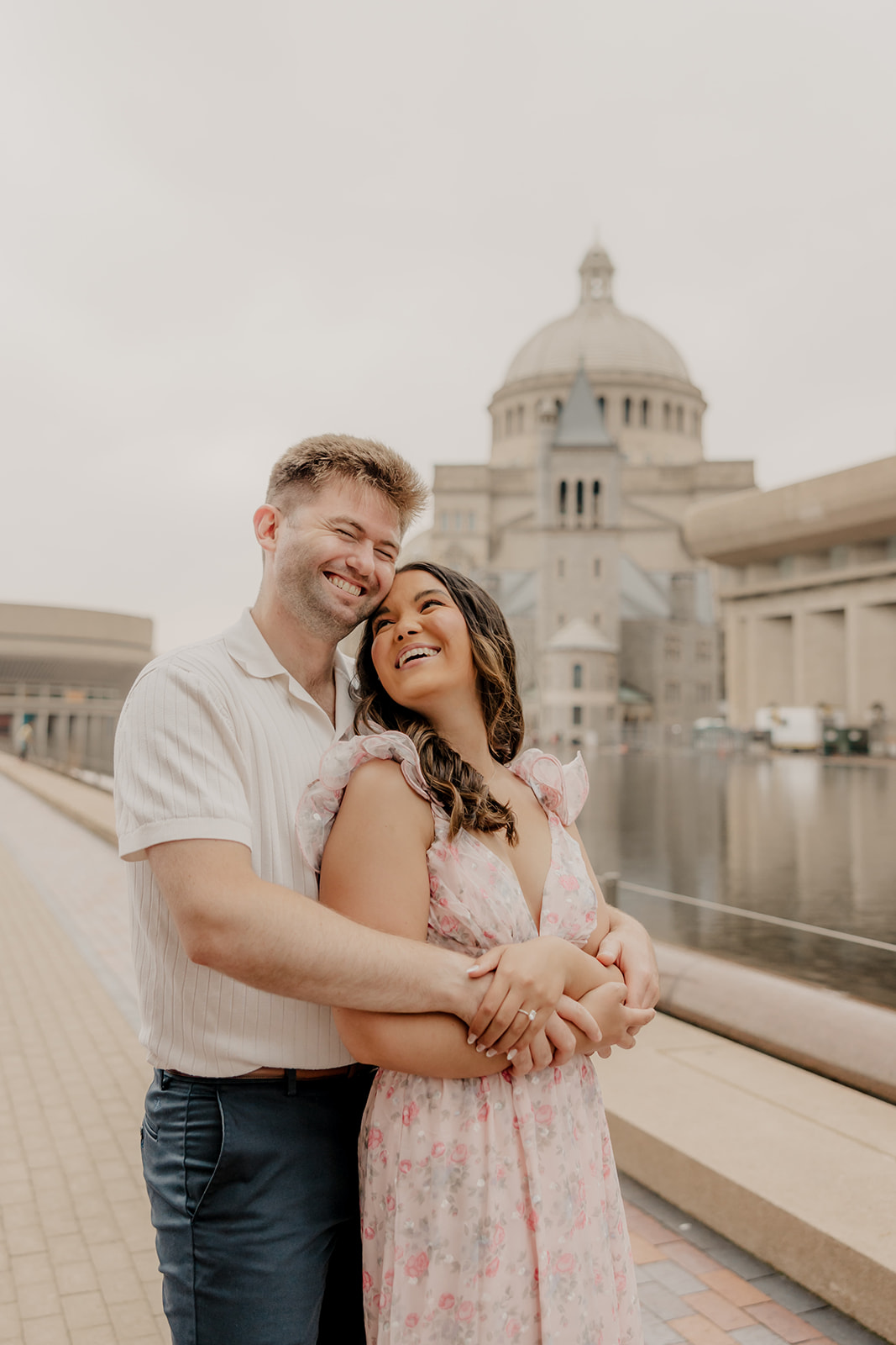 stunning couple walk together along the reflecting pond