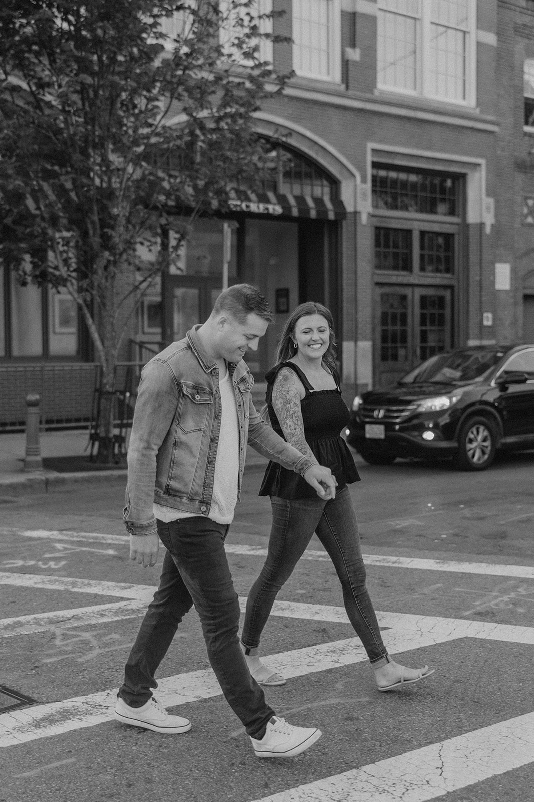 stunning couple pose together during their Boston anniversary photo shoot around Fenway Park