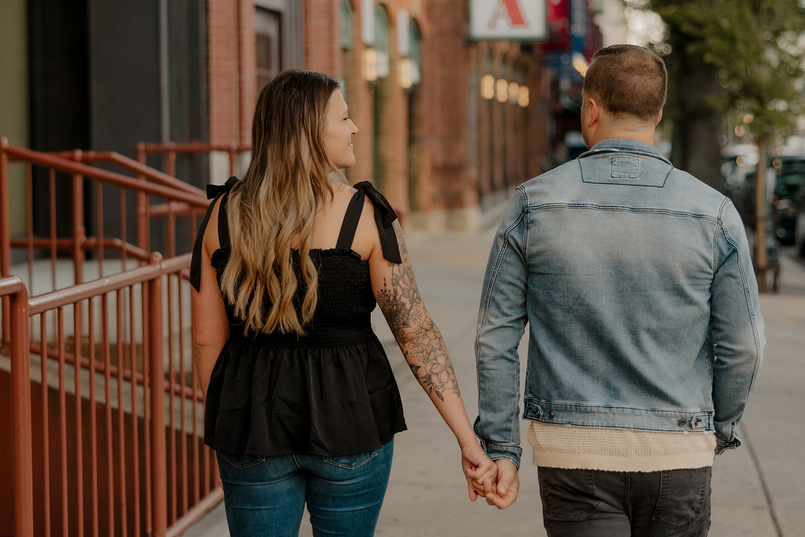 stunning couple pose together during their Boston anniversary photoshoot around Fenway Park