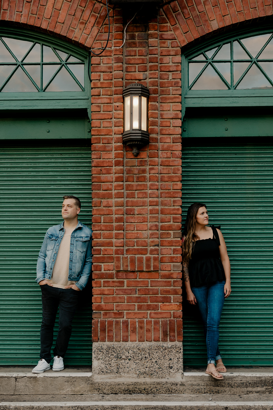 stunning couple pose together during their Boston anniversary photoshoot around Fenway Park