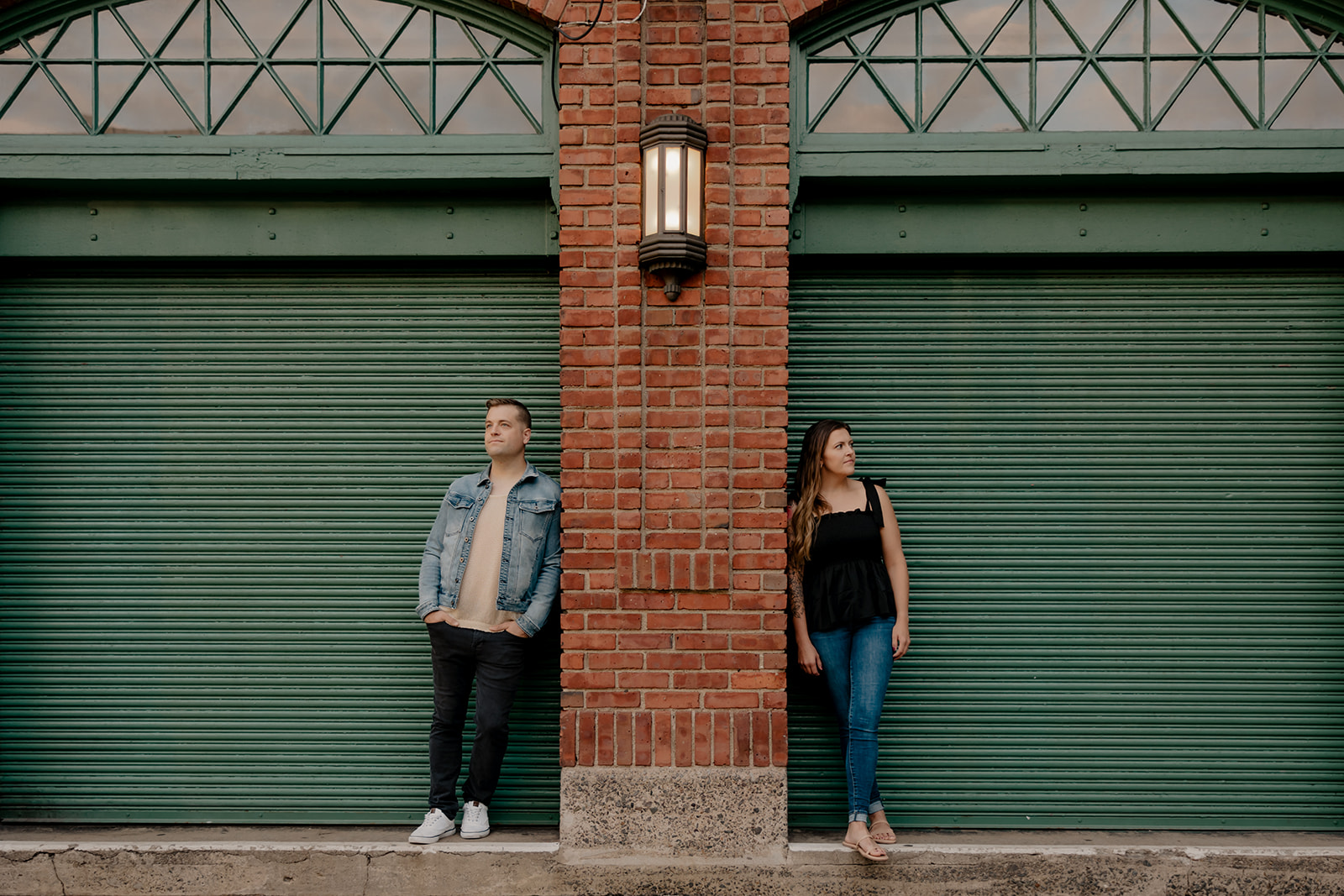 stunning couple pose together during their Boston anniversary photoshoot around Fenway Park