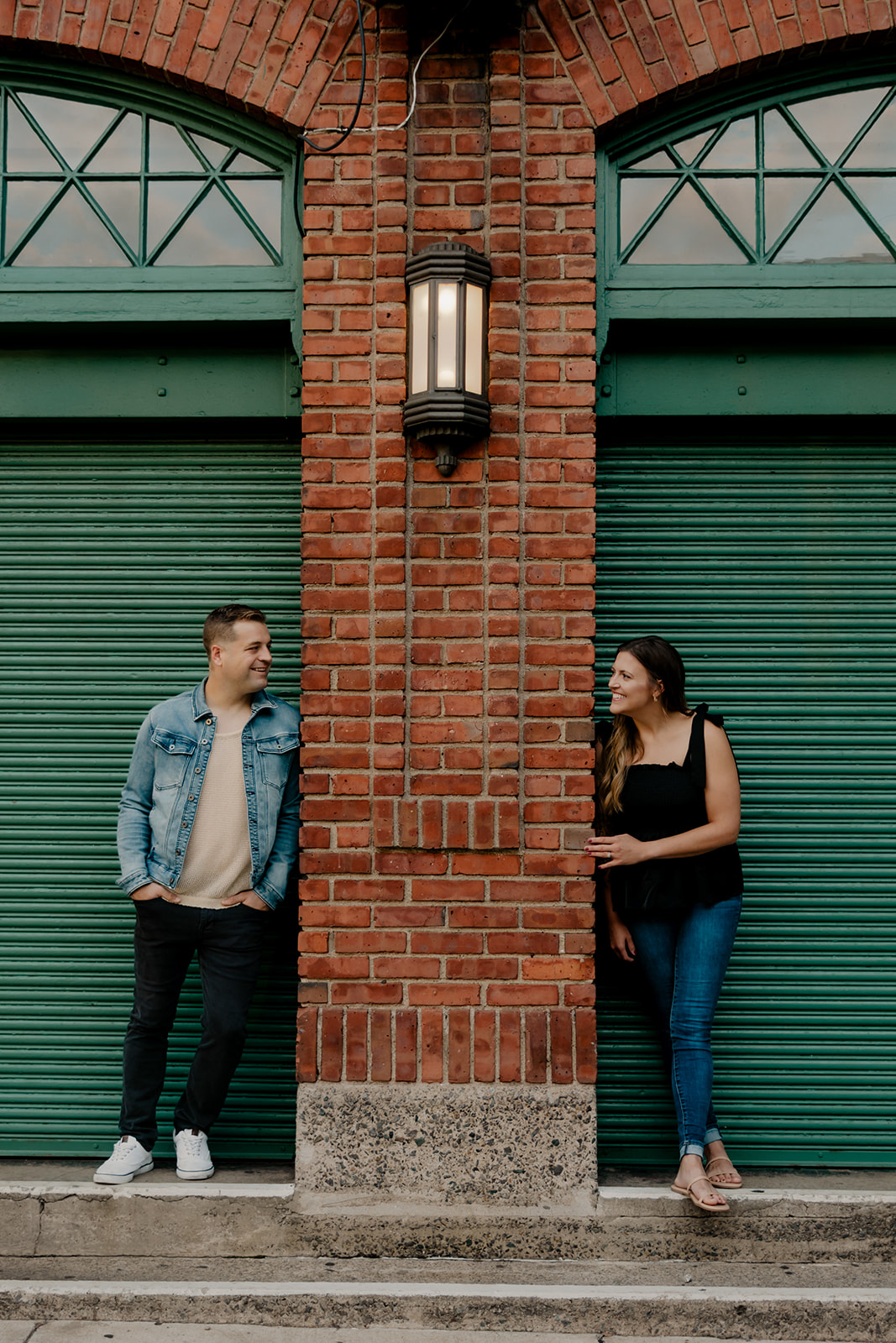 stunning couple pose together during their Boston anniversary photoshoot around Fenway Park