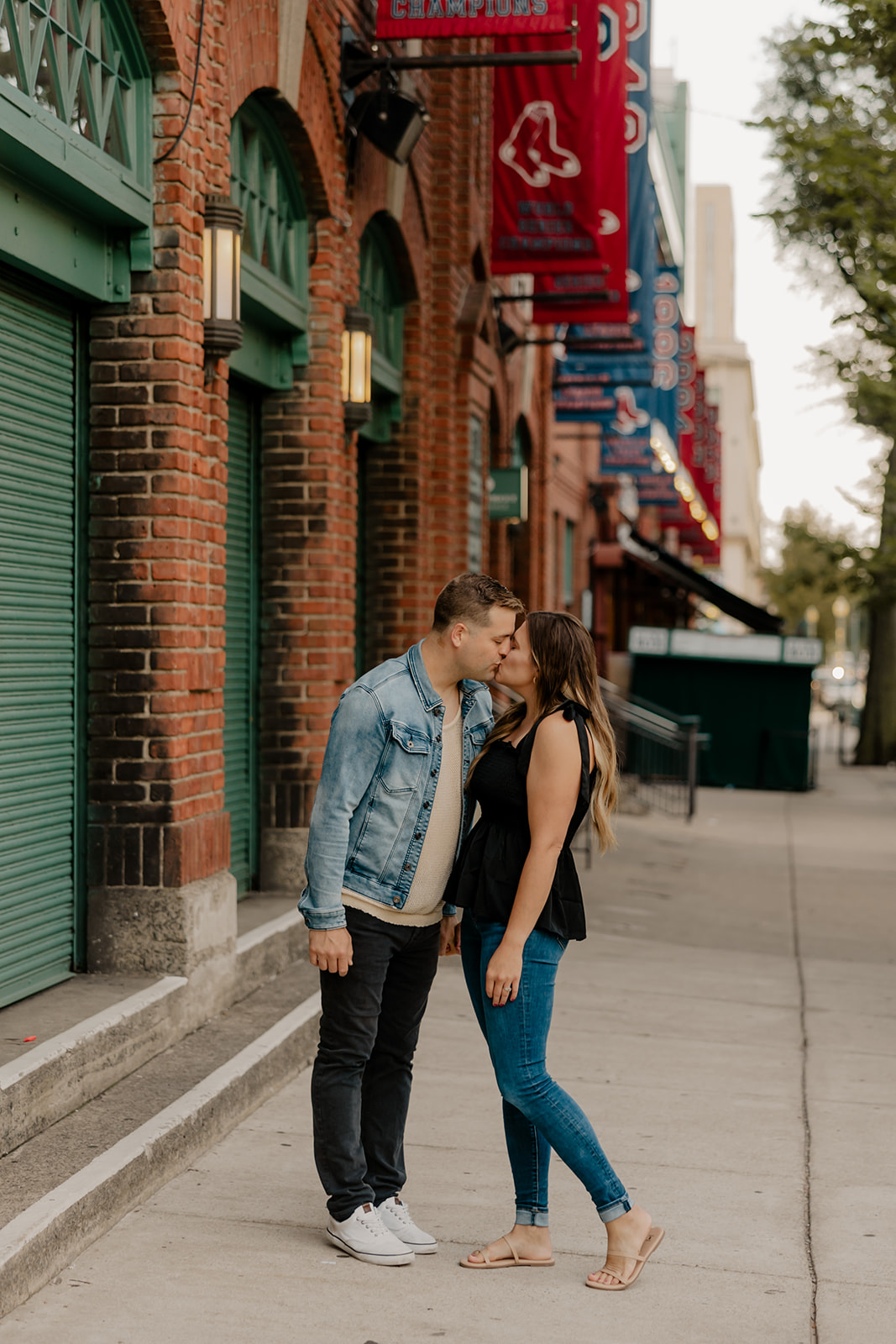 stunning couple pose together during their Boston anniversary photoshoot around Fenway Park