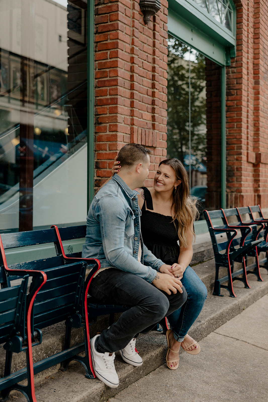 stunning couple pose together during their Boston anniversary photoshoot around Fenway Park