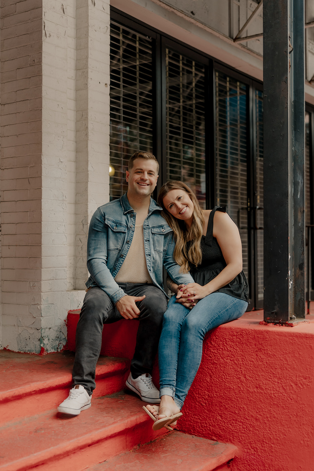 stunning couple pose together during their Boston anniversary photoshoot around Fenway Park