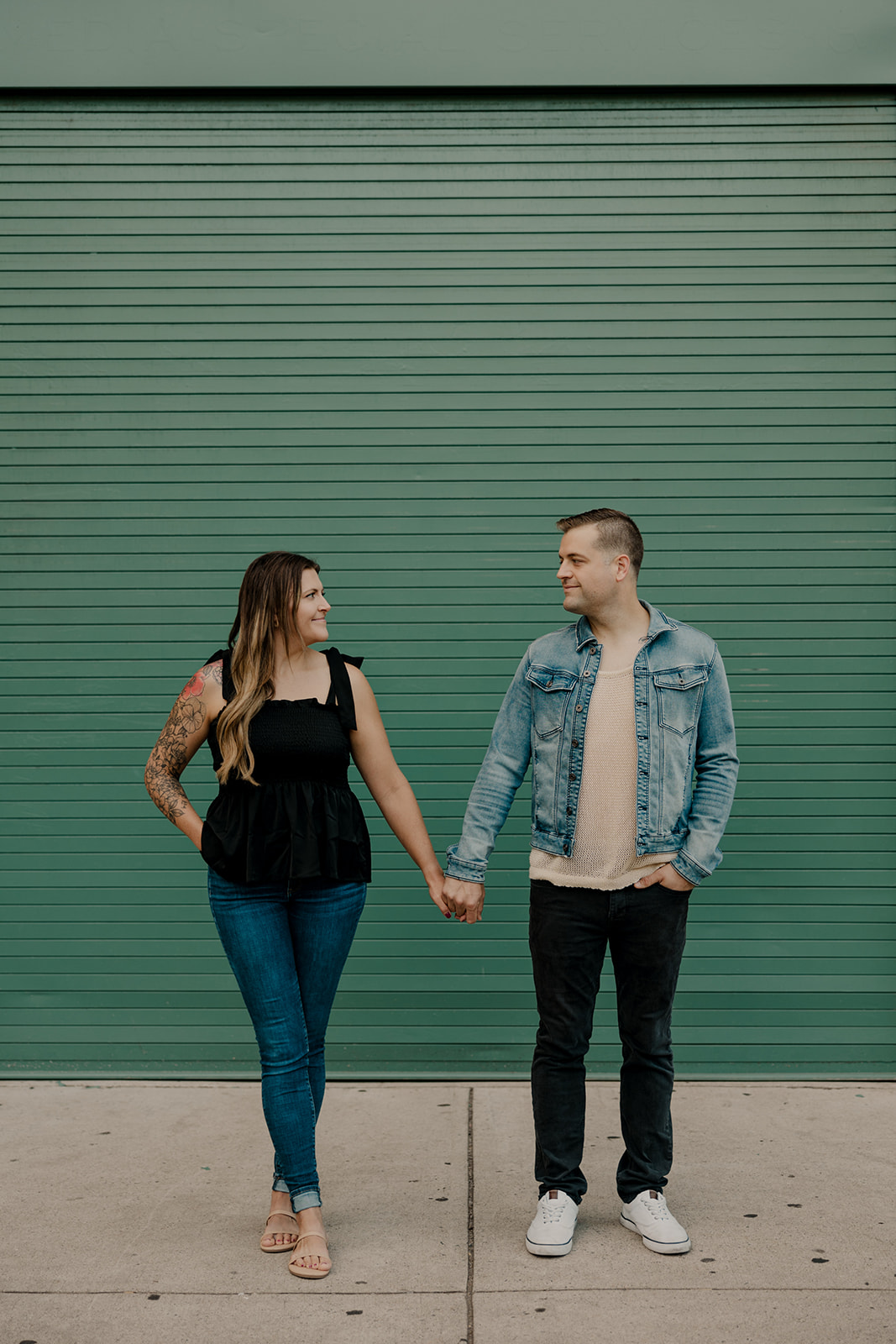 stunning couple pose together during their Boston anniversary photoshoot around Fenway Park