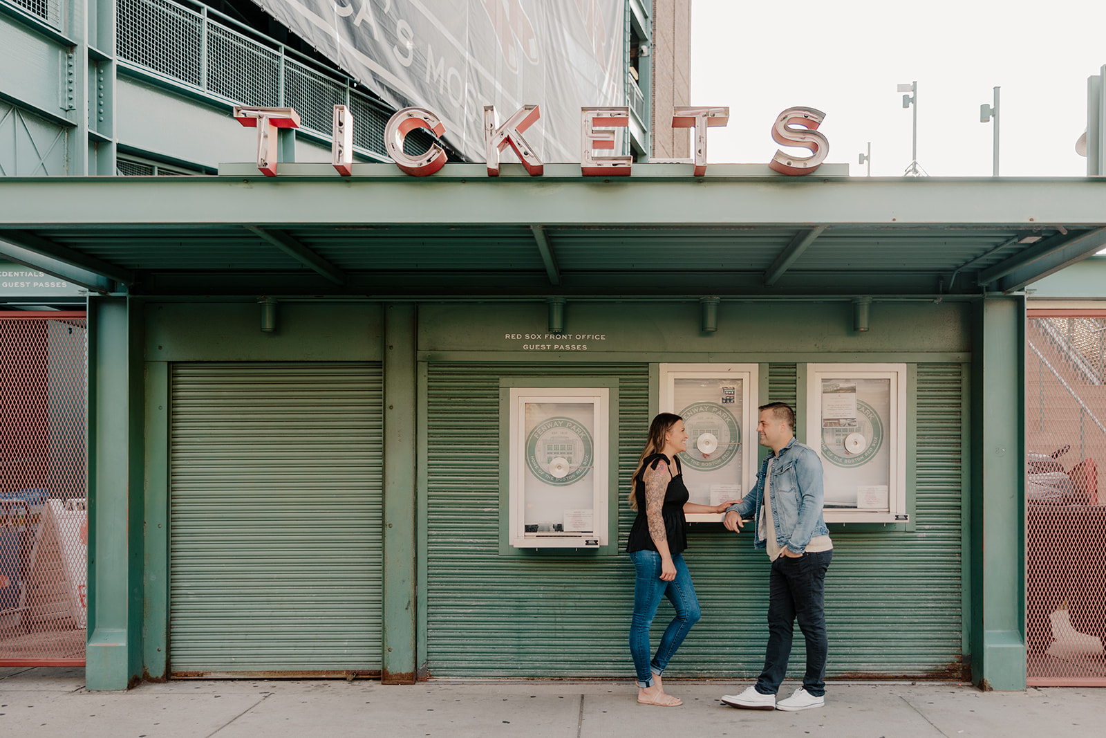 stunning couple pose together during their Boston anniversary photoshoot around Fenway Park